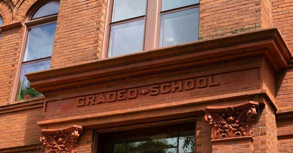 "Graded School" written in brick on the historic schoolhouse