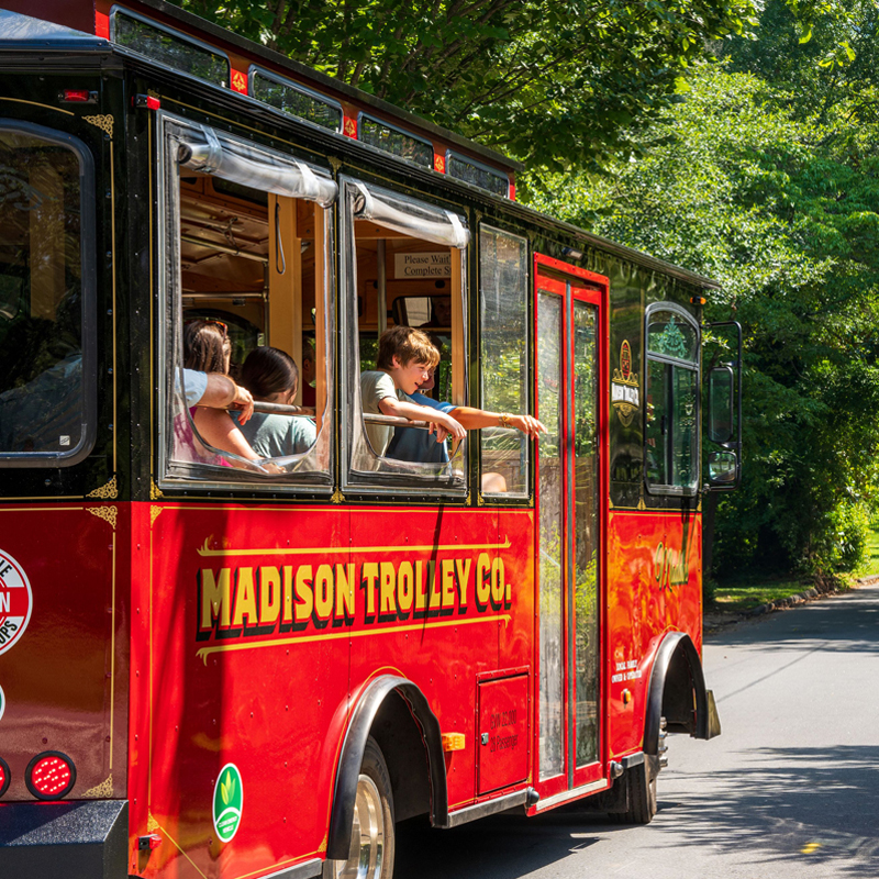 Children pointing through Trolley windows in Historic Madison, Georgia