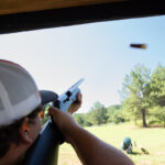 Man aims for target at sporting clays station located at Burnt Pine in Morgan County, Georgia.
