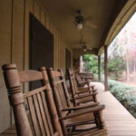 Rocking chairs on porch of Burnt Pine in Morgan County, Georgia