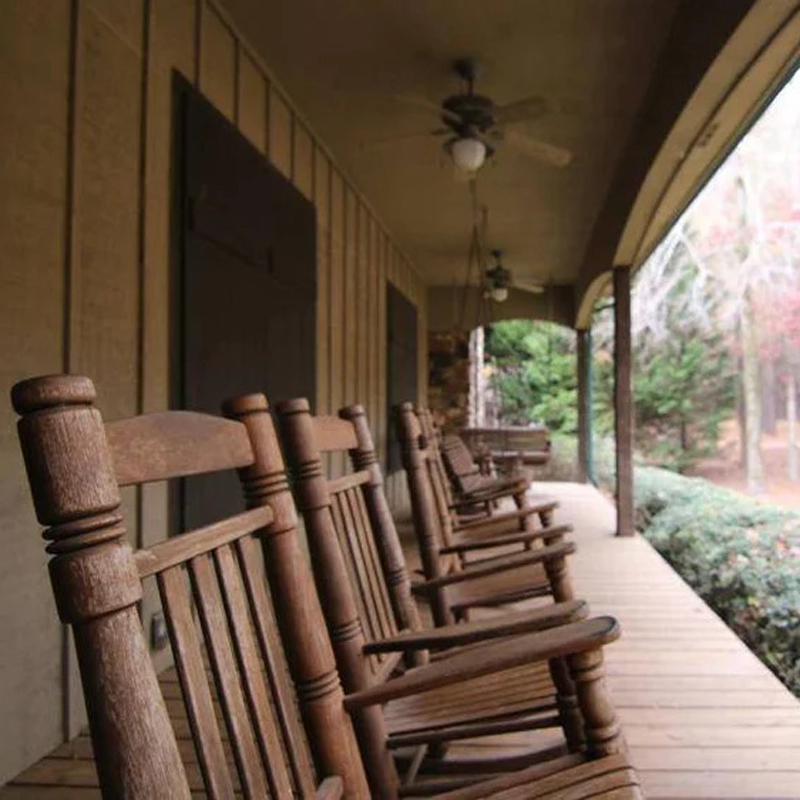 Rocking chairs on porch of Burnt Pine in Morgan County, Georgia